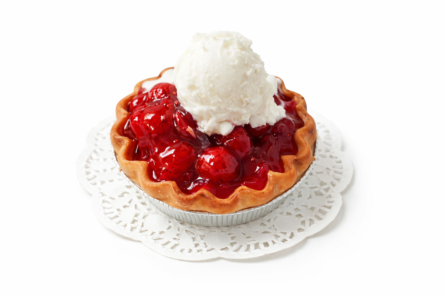 Strawberry Shortcake  pie with a scoop of vanilla ice cream on a white doily